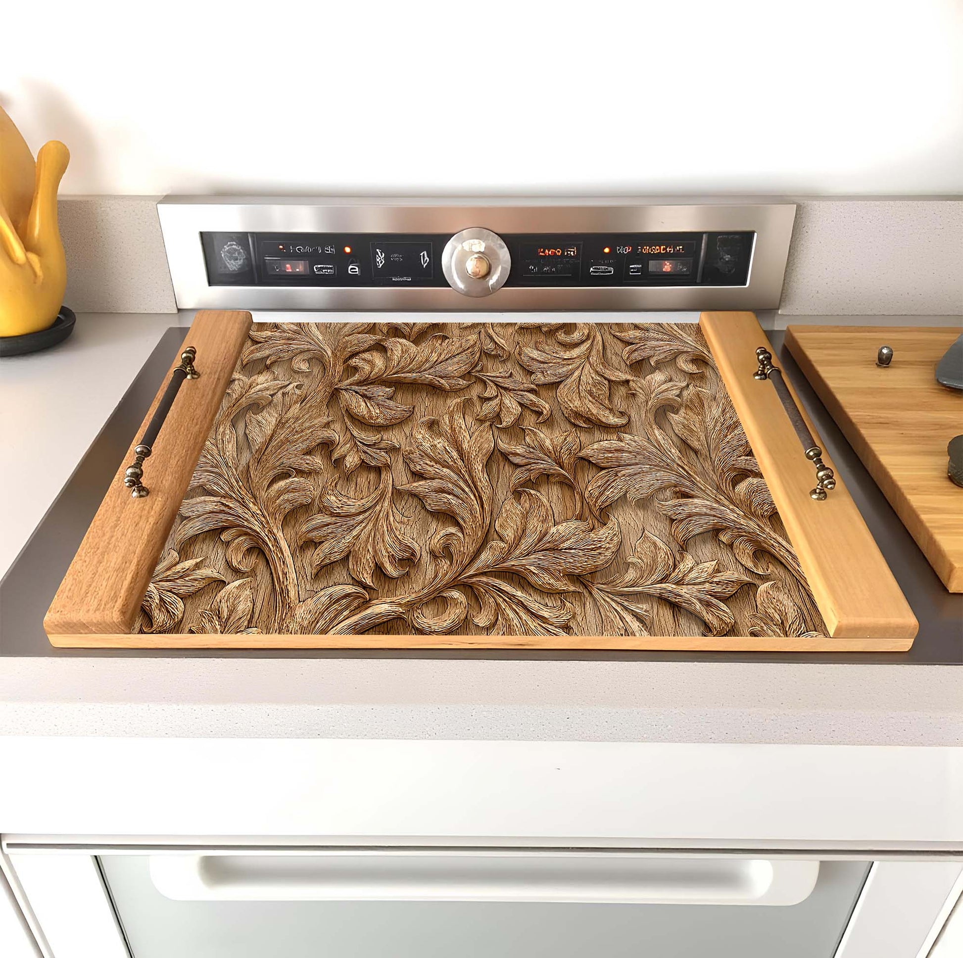 Decorative wooden stove top cover with intricate carvings on a kitchen counter.
